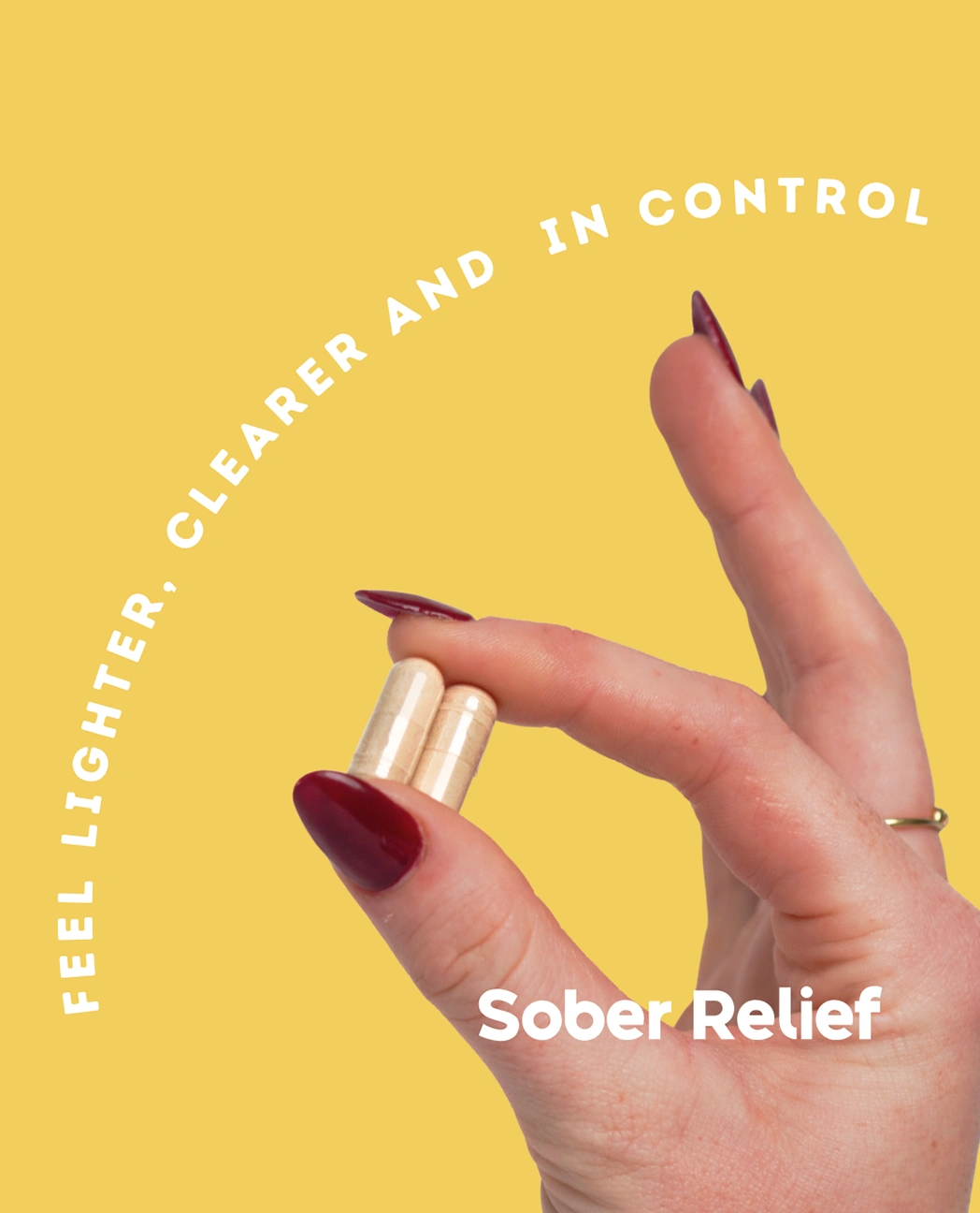 sober relief stop drinking alcohol supplements hand holding the capsules